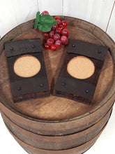 Load image into Gallery viewer, Top view of two rustic barrel stave wine glass coasters with cork-bottomed glasses indent.