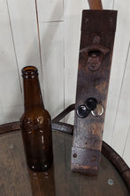 Load image into Gallery viewer, Barrel Stave Bottle Opener vertical view with bottle and caps