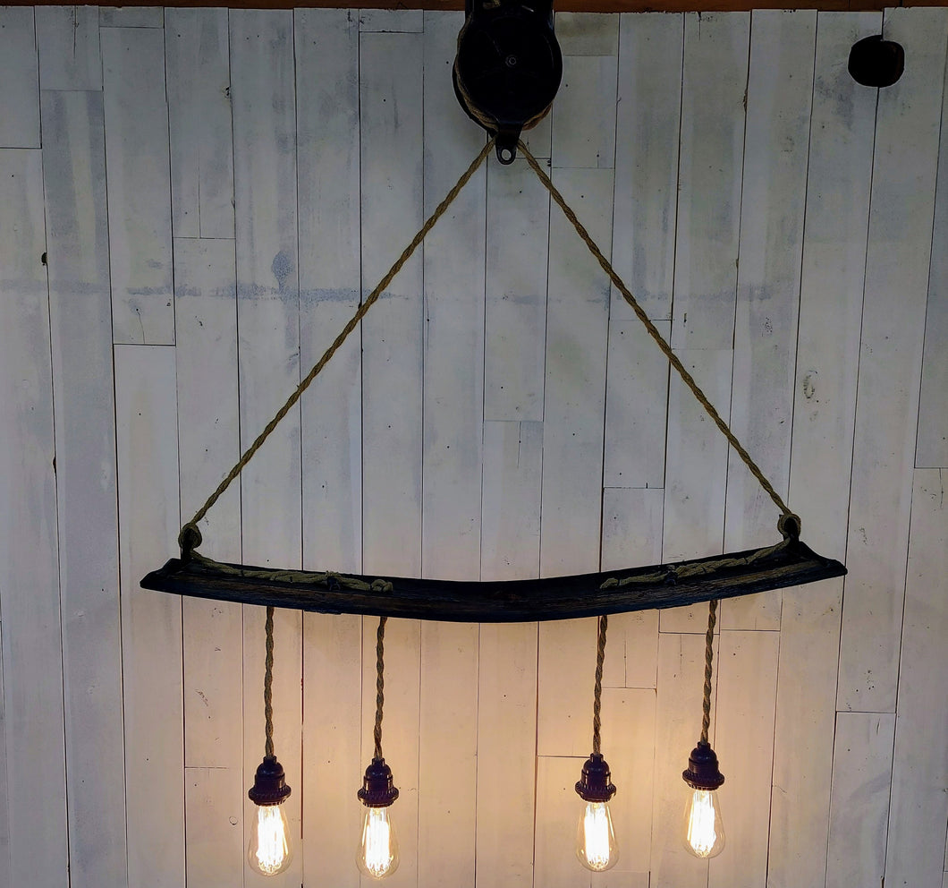 Barrel Stave with Barn Pulley Hanging Light lights on