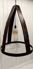 Load image into Gallery viewer, Whiskey Barrel Chandelier with oversized Edison Bulb Constructed with four barrel staves, joined at the top by 4-way crossed barrel ring metal; secured at the bottom by full barrel ring 2-ring barrel ring accents evenly distanced between top and bottom on all four staves Chandelier has a three foot hanging chain Dimensions : 33in H, 25in diameter. Light is not lluminated.
