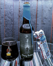 Load image into Gallery viewer, Open door view of whiskey barrel displaying customer's Bottle and glass of Timber Ale's Charging Darkness craft beer. Illuminated by white light and showing record albums below round glass.