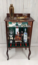 Load image into Gallery viewer, Larkin open-faced music cabinet with hunter green beadboard back panel. Displays wine and liquor bottles and staged shaker and whiskey glass.