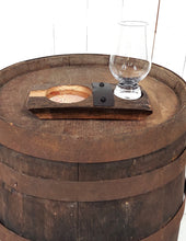 Load image into Gallery viewer, Frontal view of a genuine whiskey barrel stave, accented with a rustic barrel ring with a felt bottomed Glencairn Glass indent., and glass.  Also with a copper bottomed cigar receptacle. Measures 8” L x 4” W.
